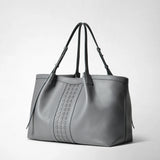 Frontal view — SECRET TOTE BAG IN CACHEMIRE LEATHER AND MOSAICO: gray Cachemire leather tote with central Mosaico stripe, long adjustable shoulder straps, soft pebbled surface, neutral studio background.