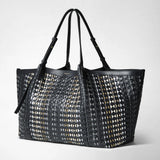 Front view of the MAXI SECRET TOTE BAG IN MOSAICO MESTIERI D'ARTE with black geometric mosaic pattern, long adjustable handles, and elegant leather finish.