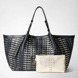 Front view of the MAXI SECRET TOTE BAG IN MOSAICO MESTIERI D'ARTE with black mosaic pattern, gold and silver accents, and a golden mini pochette in front.