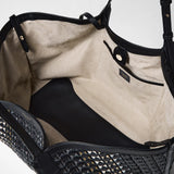 Frontal view of the interior of the MAXI SECRET TOTE BAG IN MOSAICO MESTIERI D'ARTE, featuring beige lining, black leather base, inner compartments, and a closure strap.