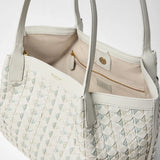 Detail view: SMALL SECRET TOTE BAG IN MOSAICO AND ELAPHE shows an open interior on a light background, woven Mosaico leather exterior, beige lining and gold zipper; visible texts: "SERAPIAN MILANO" and "SERAPIAN MADE IN ITALY".