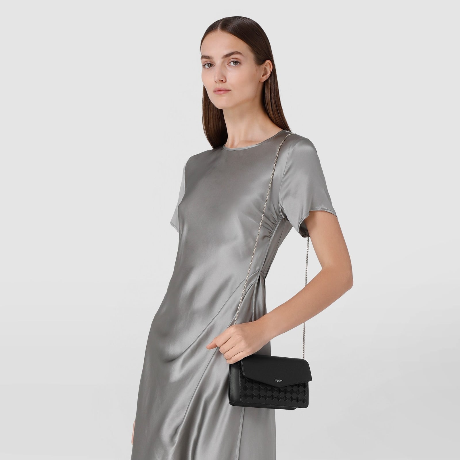 Black leather clutch bag with chain in Mosaico