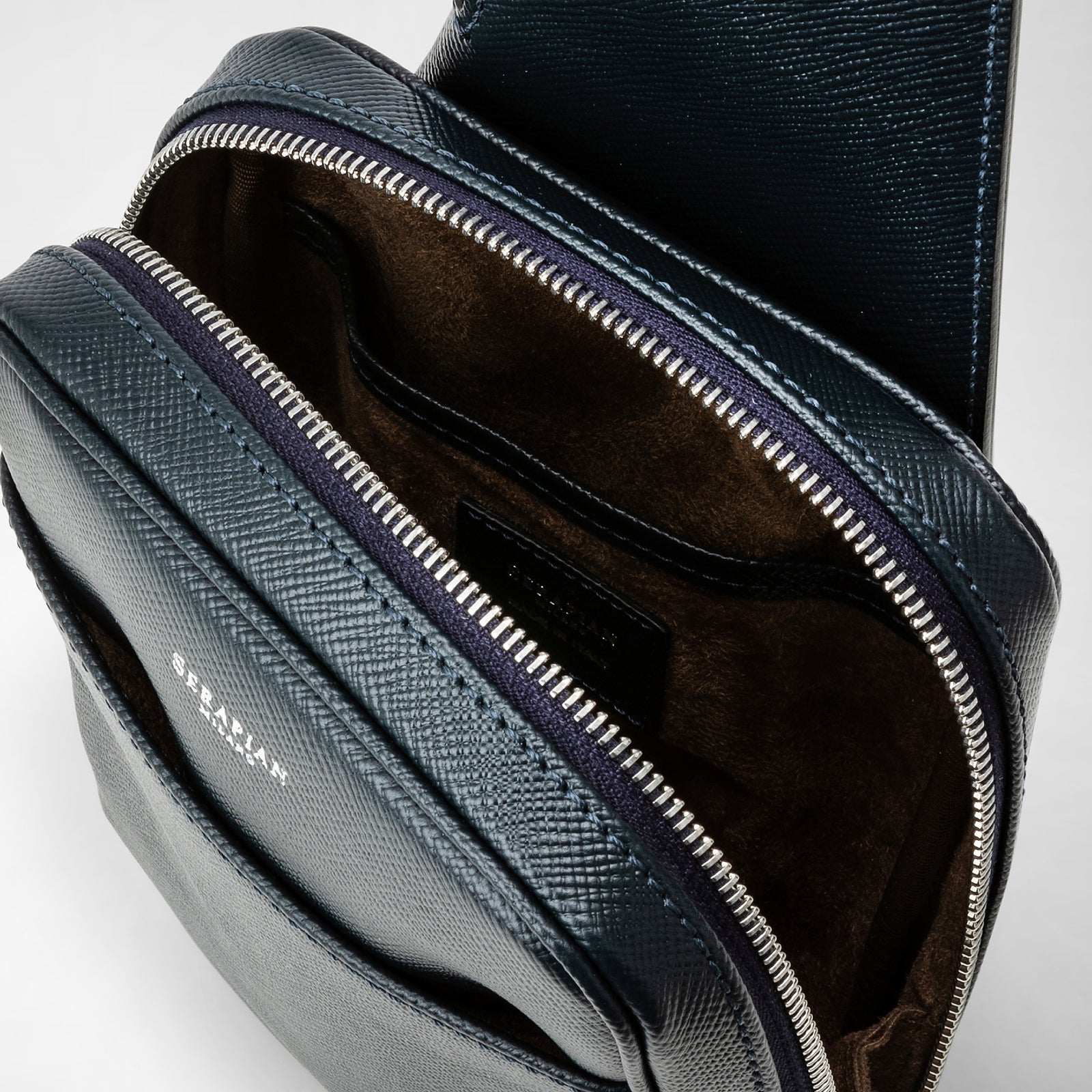 Sling backpack in evoluzione leather navy blue